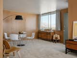 The dining area features smooth, wood-paneled walls.