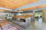 The kitchen features a 24-foot-long counter made of stainless steel and walnut.