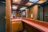 In the bathroom, even the shower is paneled in Philippine mahogany. 