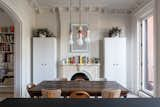 Wardrobe cabinets from Reform stand on either side of the fireplace, maximizing storage. 