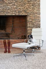 In the living area, a dry packet stone fireplace frames a fire grate that was forged by an expert blacksmith.