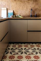 In the kitchen the designers paired ancient Sicilian decorated tiles with a refreshed, modern layout. 