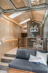 Inspired by Scandinavian and Japanese aesthetics, the modern Orchid tiny house features an interior clad in three-quarter-inch maple plywood.