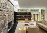 In this house by architecture firm Joeb Moore &amp; Partners, the ceiling acts as a large light shelf, distributing an even glow of natural light to the living room below.