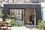 the facade is cladded with corrugated cement panels 