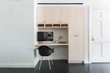 The built-in office nook is fashioned from whitened maple.