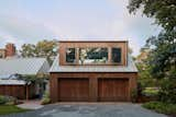 The apartment above the garage received a dormer to enlarge the interior footprint.