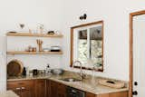 Open shelves, sourced from Rejuvenation, don’t feel as heavy as the upper cabinets installed before.