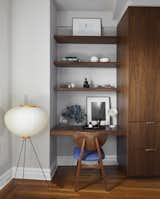 This built-in area can be used as a desk or vanity.