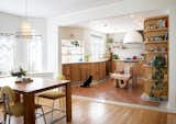 Taking cues from nautical casework, Osmose Design crafted an undulating, white oak kitchen in an irresistibly quirky Tudor home in Portland, Oregon.