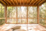 The screened porch "added even more flexibility to how [the clients] would be spending time there," says Shaw, and immerses them in the forest setting with providing protection from the bugs, including Maine’s notorious black flies.