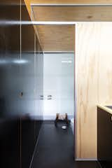 The shower is built into the curve of the structure, maximizing the unique space. 