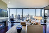 Living Area includes a sleek console table from Michael Trayler; hand-blown Murano glass console lamps from Otium.