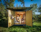 The design team sprayed the metal structure’s inner walls with thermal insulation. Then they framed the interior with studs and clad it in spruce plywood.