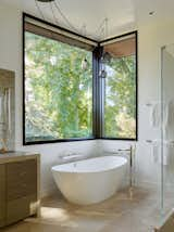 A standalone soaking tub offers respite at the end of a long day.