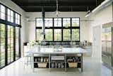 The kitchen island is topped with a five-by-10-foot slab of Carrera marble.