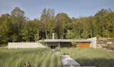 A Sleek Pool House Channeling Mies van der Rohe Grows From a Mountainside