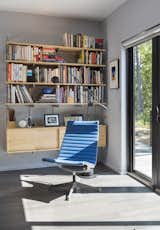 The interiors are furnished with midcentury modern pieces, including this vintage Eames Aluminum Group chair.