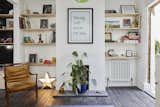 The simple plywood shelves provide a light contrast to the original Victorian floorboards that the couple finished with OSMO ebony oil.