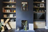 The living room features Conran paint in Highland Rainy Slate. The dyed concrete fireplace hearth was poured in situ.