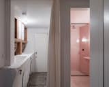 A peek into the new ground-floor guest bathroom, which is finished in pink paint.