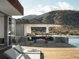 Ridge Mountain Residence was designed to blend into the existing Palm Springs landscape. Cor-Ten steel cladding provides a naturally weathering material, while the concrete structure and flagstone terrace complement the light tones of the surrounding mountains.