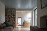 Built-in bookcases in the living room echo the birch ply of the kitchen cabinetry.