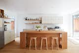 Kitchen Space: The kitchen island design is inspired by Donald Judd's Library Table and was built with the flexibility of removing the cabinet storage to convert it to a counter-height table.