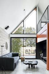 The rear facade has been divided into two, with a fully glazed wall that floods the living space with natural light.