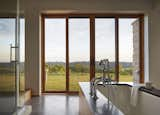 The homeowner also crafted the surround of the bathtub in the master bathroom.