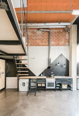 The kitchen tiling was selected as it was the least expensive on the market, and a graphic arrangement of the tiles creates an interesting focal point. 