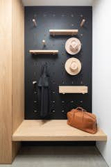 The mudroom, outfitted in custom oak millwork, connects the garage to the entry hall.