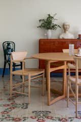 Other pieces of furniture were sourced from vintage dealers. The chest of drawers was lacquered in a brick hue to match the color of a neighboring building.