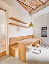 Local craftsmen made-to- measure bench and banquette in oak, with matching shelves and built-in drawers to maximize storage.