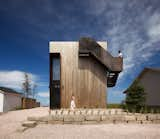 Foul Weather Is No Match for This Boxy New Brunswick Home—or the Steel Stair Wrapped Around It