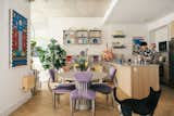 Mikei, his partner, and their dog Shabu Shabu in their living space. The table was made for the outdoors, but repurposed for the dining area from Urban Outfitters. It's surrounded by '80s-era vintage chairs sourced from Betsu. 