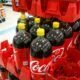 Coke bottles with yellow caps