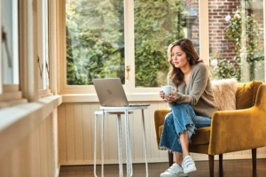 Woman interacting with a HP Pavillion laptop.