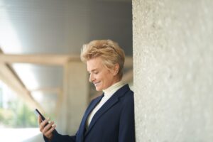 a person wearing a suit and tie talking on a cell phone