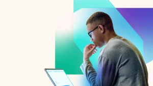 Man on laptop with green and white background