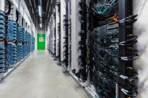 Microsoft datacenter hot aisle row of tall server racks left.