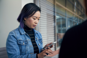 Woman answering message on her phone