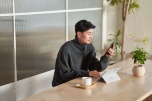 Photo of a person looking at a mobile phone