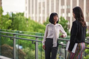 Two public service workers having a discussion at city hall.