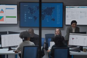 Chief information security officer collaborating with practitioners in a security operations center.