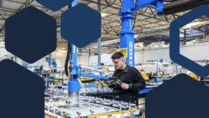 Photo of a worker using industrial tool in electronics factory assembly line.