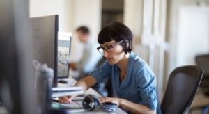 a woman sitting at a desk