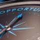 Compass with needle pointing the word opportunity, concept image to illustrate business opportunities and strategy.