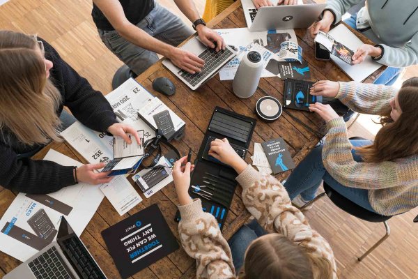 A group of people using iFixit tools