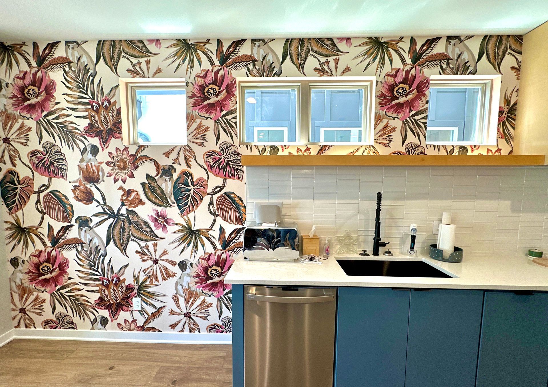 A kitchen with a floral wallpaper on the wall and a sink in Nashville, TN